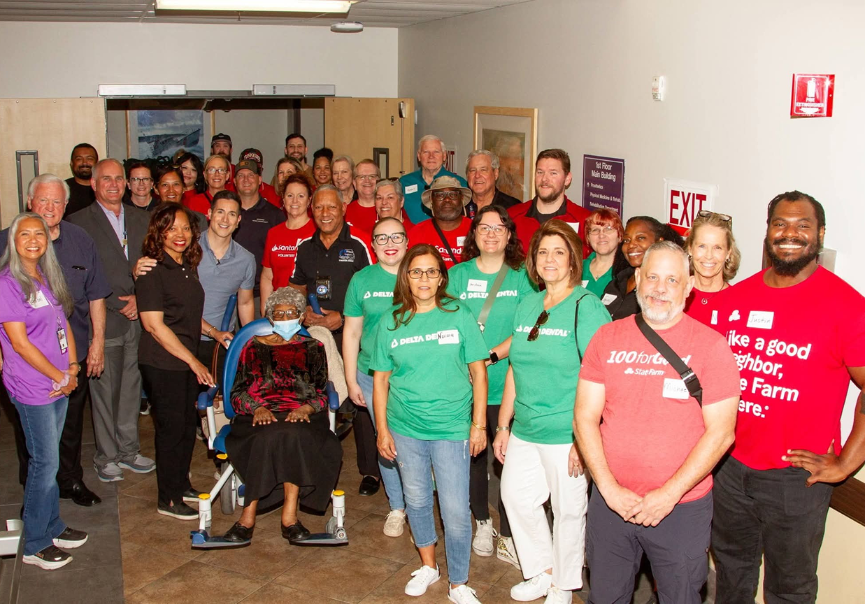 Diverse volunteers posing at community service event